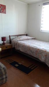 מיטה או מיטות בחדר ב-"ERyMAR" CASA PARA FAMILIAS A PASOS DE CALETA HORCON