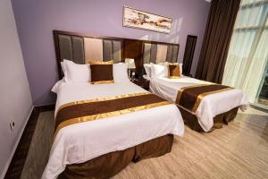 Postel nebo postele na pokoji v ubytování Hotel City Plaza & Suites