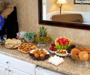 a buffet of food on a counter in a room at Atlantic View Hotel in Dewey Beach