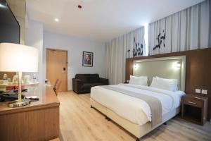 Voodi või voodid majutusasutuse La Locanda Boutique Hotel toas