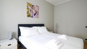 a bedroom with two beds with white sheets at Italianway - Dogali 17 in Santa Margherita Ligure