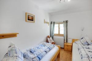 Katil atau katil-katil dalam bilik di Almrausch Ferienwohnung