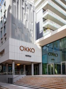
a large building with a sign on the side of it at OKKO Hotels Toulon Centre in Toulon
