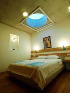 Un pat sau paturi într-o cameră la Datça Vineyard