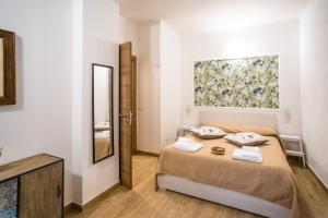 Postel nebo postele na pokoji v ubytování Valle dei Mulini - Apartment