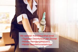 a picture of a woman holding a toothbrush at Maingau Hotel in Frankfurt/Main