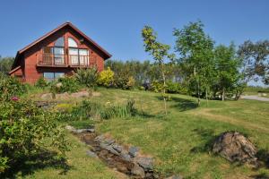 a house on a hill with a grass yard at Retallack Resort by Away Resorts in Padstow
