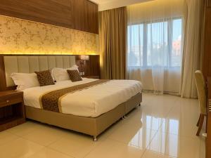 Postel nebo postele na pokoji v ubytování Kayan Al Taif Hotel + 37 fotografií
