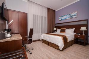 Postel nebo postele na pokoji v ubytování Hotel City Plaza & Suites