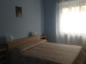 Ein Bett oder Betten in einem Zimmer der Unterkunft B&B Il Dormiglione