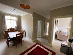 a kitchen and dining room with a table and chairs at Lade Braes Lane, Westview House, Westview, St. Andrews, Fife, KY16 9ED in St. Andrews +14 photos