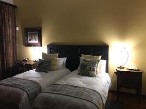 Postel nebo postele na pokoji v ubytování Five Sisters
