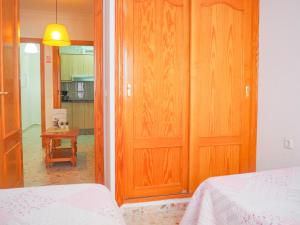 Posteľ alebo postele v izbe v ubytovaní ConilPlus apartments AZORIN II