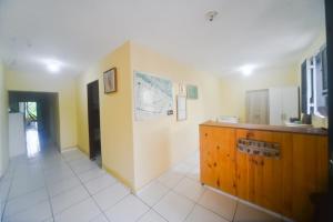 a large room with a counter and a unintention at Casa do Professor Hostel in Barreirinhas
