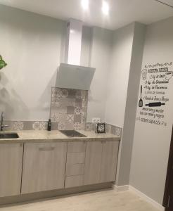 a kitchen with a sink and a counter top at CASA DE TOSCA in Lucena