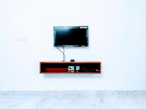 A television and/or entertainment centre at Elegano Serviced Apartments