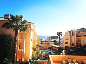a view of a resort with a pool and buildings at Praia da Luz Monique Apartment in Luz
