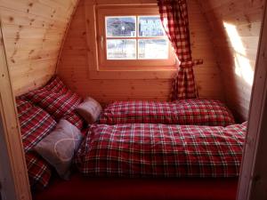 Postel nebo postele na pokoji v ubytování Romantischer POD - Gegen Aufpreis mit Hot Tub - Whirlpool & Sauna
