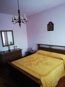 Säng eller sängar i ett rum på La Tana di Brocciolino