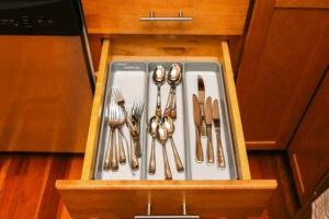 a drawer filled with utensils in a kitchen at Stylish 1BR in Malden #3 in Malden
