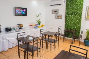 TV a/nebo společenská místnost v ubytování Hotel Verona