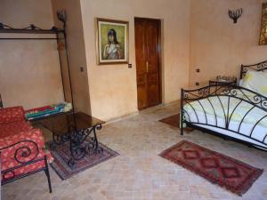 Voodi või voodid majutusasutuse Hotel Riad L' Arganier D' Or toas
