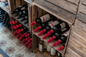 a wooden crate filled with lots of wine bottles at Alcudia Petit - Turismo de Interior in Alcudia