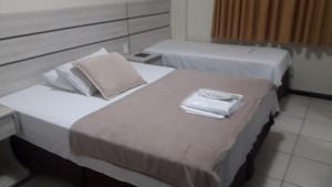 Postel nebo postele na pokoji v ubytování Esplendor Palace Hotel