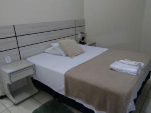 Postel nebo postele na pokoji v ubytování Esplendor Palace Hotel