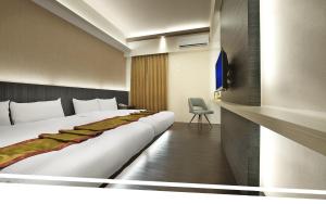 Letto o letti in una camera di One Fukun Hotel
