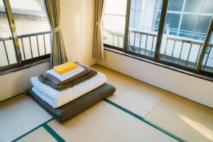 Postel nebo postele na pokoji v ubytování Onsen Guesthouse HAKONE TENT