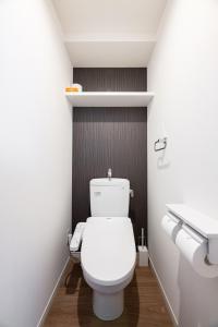 a bathroom with a white toilet and a sink at Grand Inn Canalside in Fukuoka +53 photos