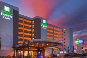 a hotel with a building with a casino at Holiday Inn Express & Suites Panama City Beach Beachfront, an IHG Hotel in Panama City Beach