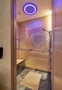 
a bathroom with a tub and a shower stall at Vivanta Bengaluru Residency Road in Bangalore
