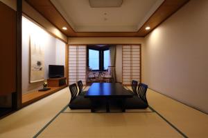 a dining room with a table and chairs at Kamakura Park Hotel in Kamakura