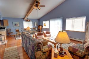 a living room with a couch and a table at Sea Parrot Inn in Seldovia