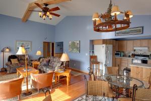a living room with a couch and a table at Sea Parrot Inn in Seldovia
