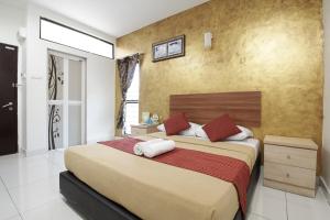 Postel nebo postele na pokoji v ubytování COOP HOTEL PUTRAJAYA & CYBERJAYA