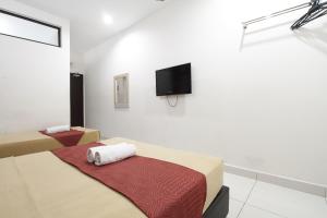 TV a/nebo společenská místnost v ubytování COOP HOTEL PUTRAJAYA & CYBERJAYA