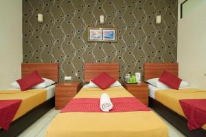 Postel nebo postele na pokoji v ubytování COOP HOTEL PUTRAJAYA & CYBERJAYA