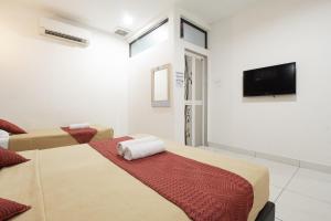 TV a/nebo společenská místnost v ubytování COOP HOTEL PUTRAJAYA & CYBERJAYA