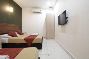TV a/nebo společenská místnost v ubytování COOP HOTEL PUTRAJAYA & CYBERJAYA