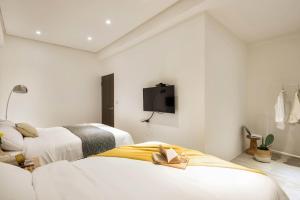 Postel nebo postele na pokoji v ubytování 單眼皮民宿 Single Eyelid Hostel