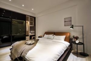 Postel nebo postele na pokoji v ubytování 單眼皮民宿 Single Eyelid Hostel