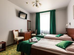 Postel nebo postele na pokoji v ubytování Hotel Skalite Spa & Wellness