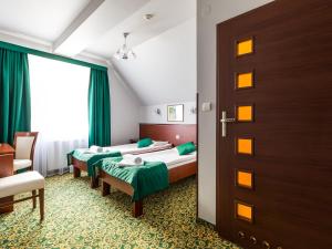 Postel nebo postele na pokoji v ubytování Hotel Skalite Spa & Wellness