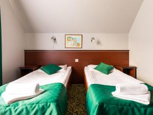 Postel nebo postele na pokoji v ubytování Hotel Skalite Spa & Wellness