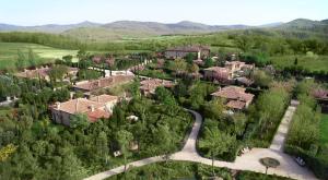 arial view of a home in a green field at Borgo Santo Pietro in Chiusdino