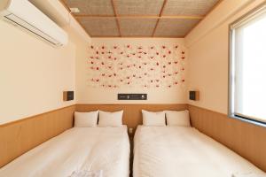 Letto o letti in una camera di Kamon Hotel Namba