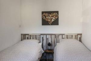 Postel nebo postele na pokoji v ubytování Vakantie met sauna in Zeeland